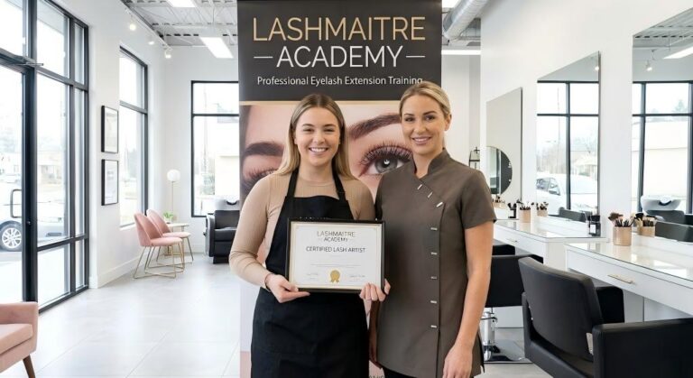 A happy graduate proudly holding her "Certified Lash Artist" certificate alongside a LASHMAITRE trainer at our academy salon, marking the completion of her eyelash extension course in Brisbane.