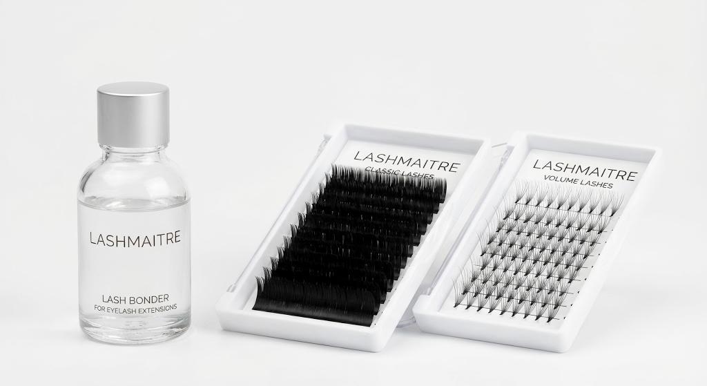 A close-up catalog shot of LASHMAITRE lash bonder for eyelash extensions bottles positioned next to classic and volume lash trays on a clean white background.