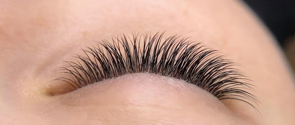 High-definition LASHMAITRE macro photography displaying detailed before and after eyelash extension results, focusing on perfect curl, added density, and symmetry.