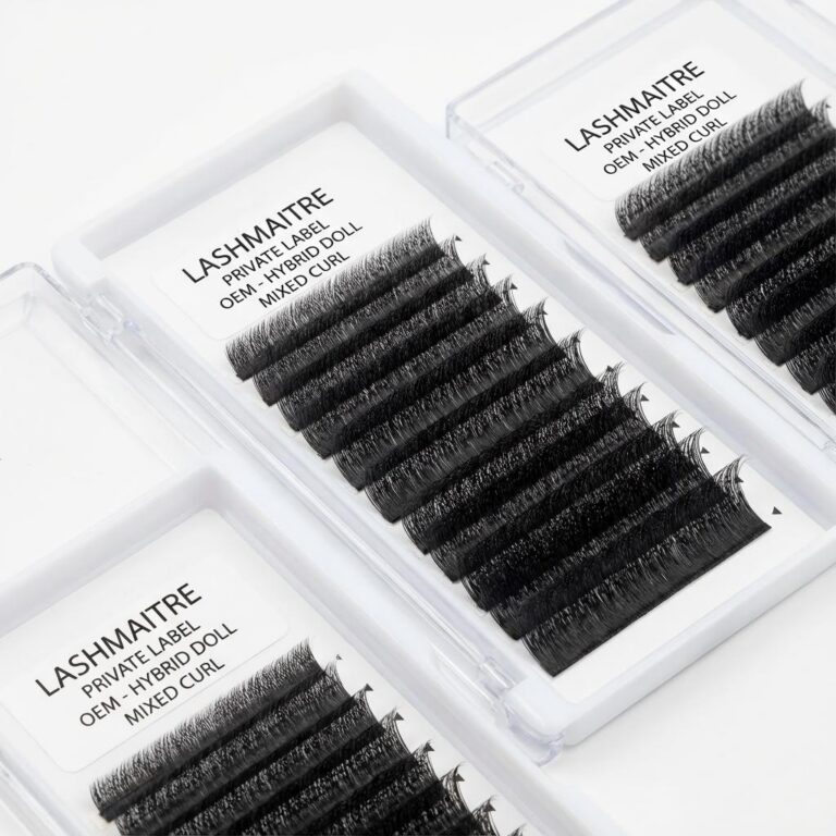 A close-up view of LASHMAITRE private label trays featuring mixed curl hybrid doll lashes wholesale options for OEM branding.
