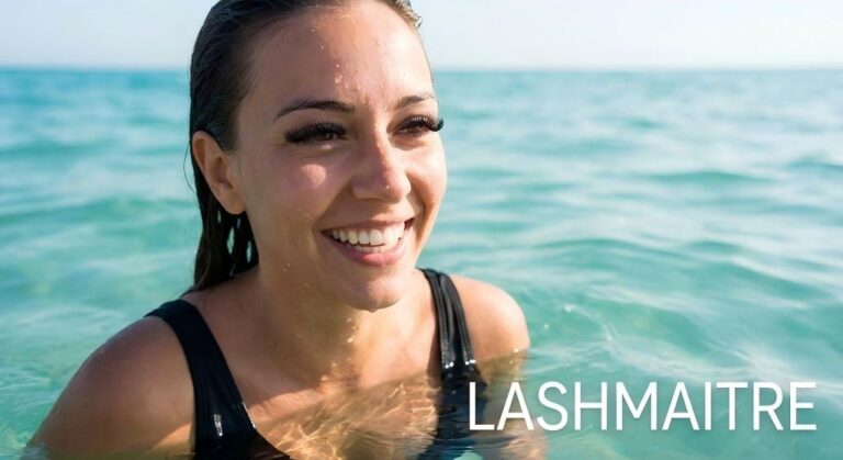 "LASHMAITRE lifestyle photograph of a smiling woman swimming in turquoise ocean water with wet, perfectly intact lashes, serving as visual confirmation for those asking 'can you swim with eyelash extensions'."