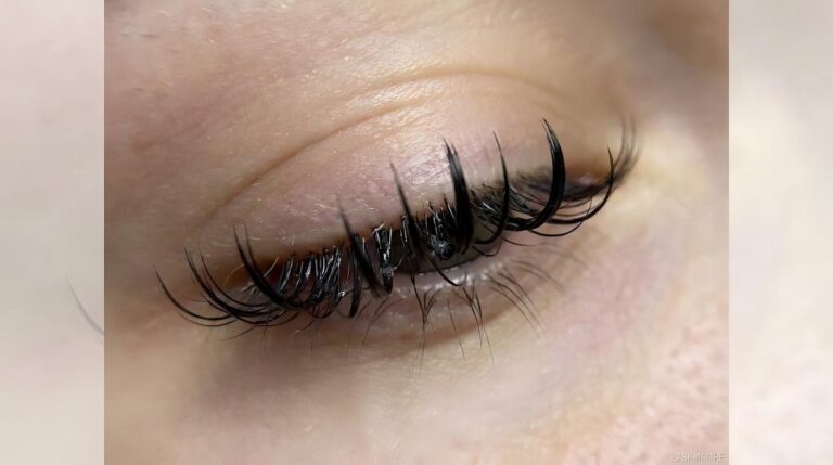 Macro close-up photography revealing defects in substandard lash extensions, such as uneven curl patterns, inconsistent thickness, and rough finishes.
