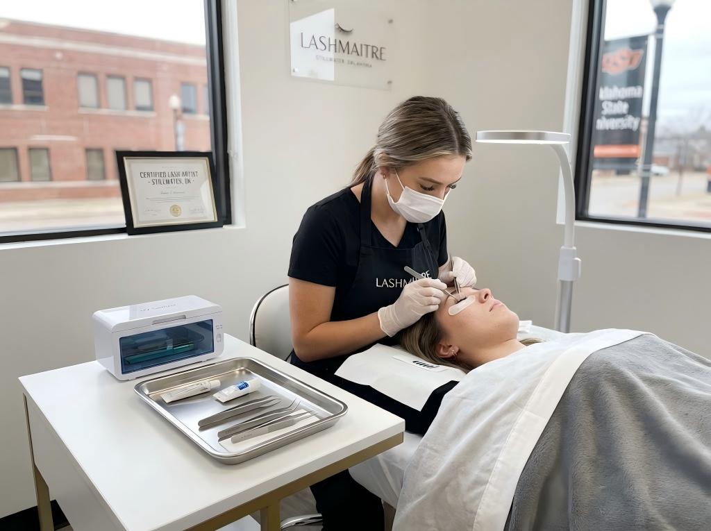 A licensed lash artist performing a hygienic application in a clean, inspection-ready workspace, representing the professional standard for eyelash extensions Stillwater, Oklahoma.