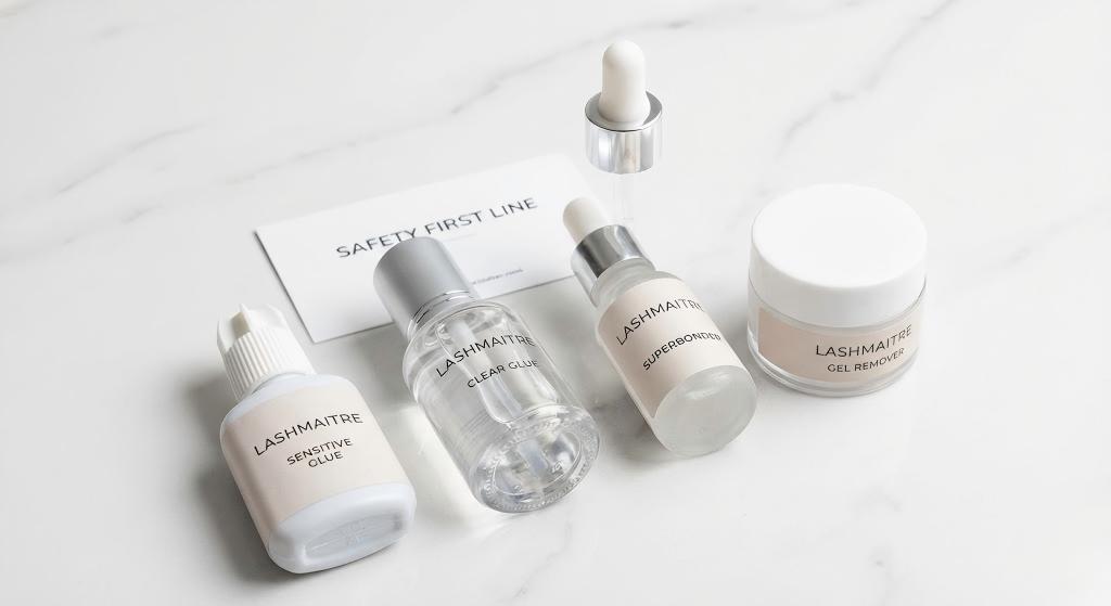 Product collection shot of LASHMAITRE's "Safety First" line (Sensitive Glue, Clear Glue, Superbonder, Gel Remover) designed to prevent and manage allergy to eyelash extension reactions.