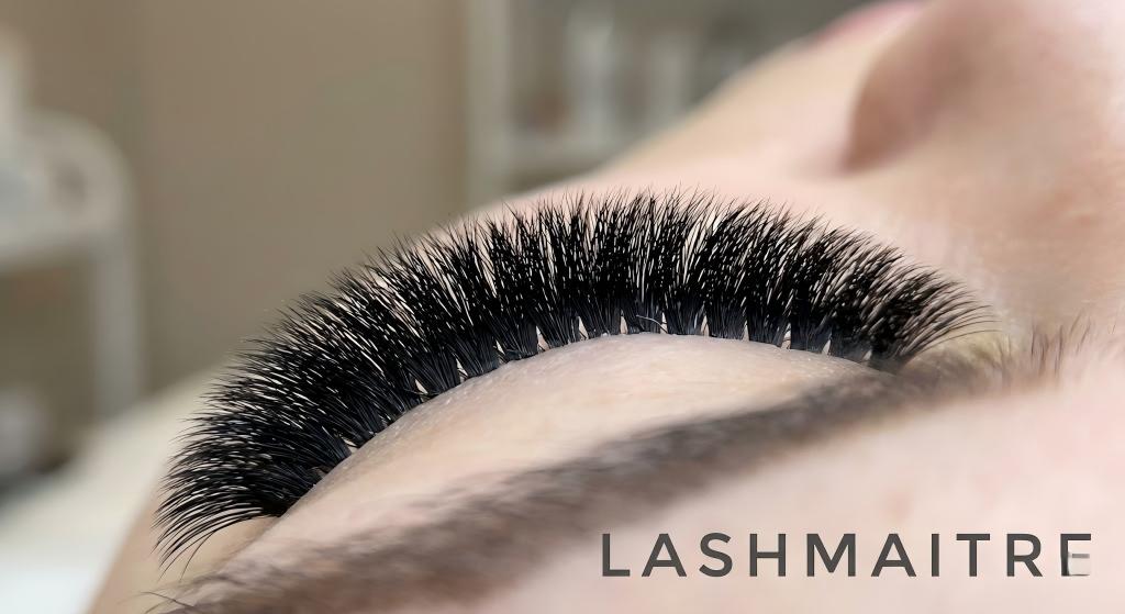 "Extreme close-up of a LASHMAITRE client's eye showcasing the ultra-matte, velvety texture of a Cashmere Flat Lash set, demonstrating the ideal natural styling for eyelash extensions in Fairfield CT."