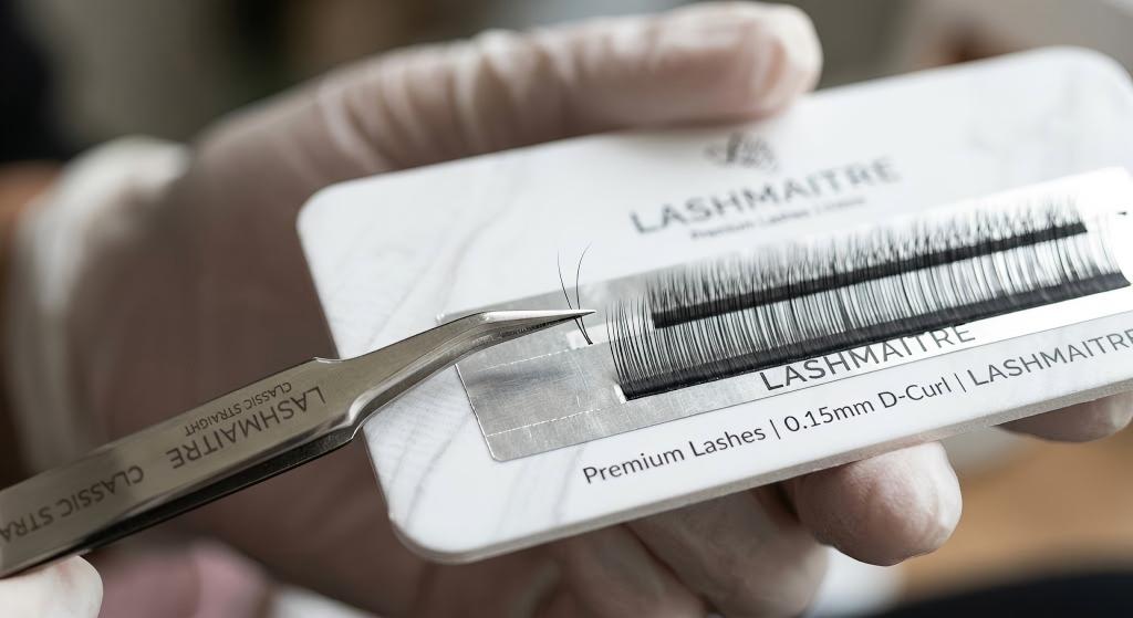 Micro-calibrated tweezers for classic eyelash extensions lifting PBT fiber from foil backed tape strip